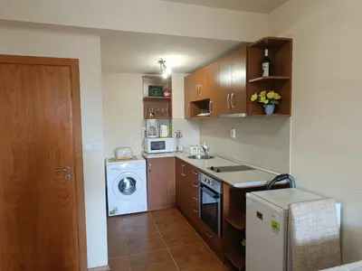 a small kitchen with a washing machine and a washer at Ski holiday in Lucky Pamporovo in Pamporovo