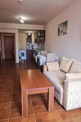 a living room with a couch and a table at Ski holiday in Lucky Pamporovo in Pamporovo