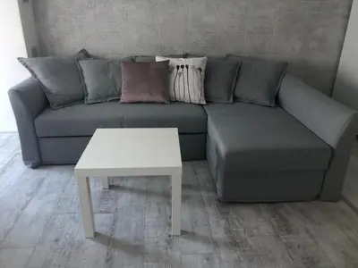 a living room with a couch and a table at Cozy and modern apartment Krasno selo, free parking in Sofia