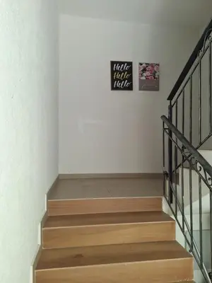 a set of stairs with a sign on the wall at Danaya in Petrich