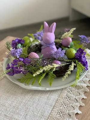 a plate with a bunny sitting on top of flowers at Къщата на Анхел in Sofia