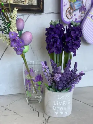 a couple of vases with purple flowers in them at Къщата на Анхел in Sofia