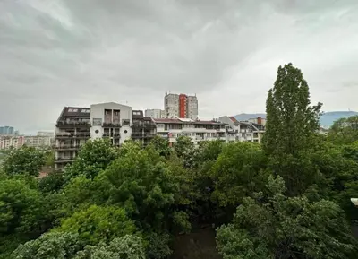 a city skyline with tall buildings and trees at Къщата на Анхел in Sofia