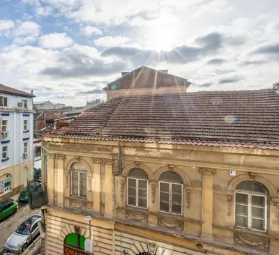 an old building with a brown tile roof at Golden Glow Residence in Sofia