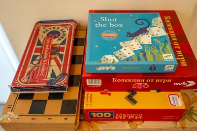 three books sitting on top of a table at Premium comfy 2BDR Apt - Free Parking - Fast Wi-Fi in Sofia