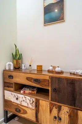 a wooden desk with drawers and a picture on the wall at Premium comfy 2BDR Apt - Free Parking - Fast Wi-Fi in Sofia