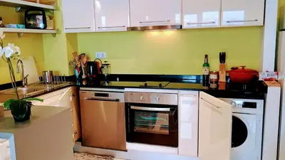 a kitchen with a stove and a dishwasher at Terra SP apartments-Razlog in Razlog