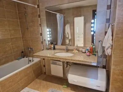 a bathroom with a toilet and a sink and a tub at Terra SP apartments-Razlog in Razlog