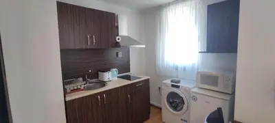 a kitchen with a sink and a washing machine at Royal Park SP apartments-Bansko in Bansko