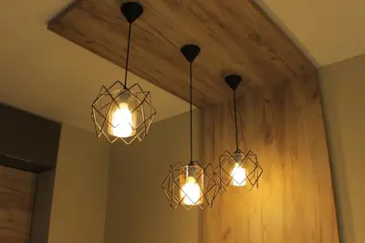 a couple of lights hanging from a ceiling at Beautiful Apartment free Parking Garage in Plovdiv