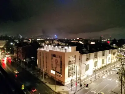a view of a city at night with a building at Top-Center BestView Apartment in Sofia