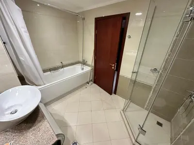 a bathroom with a sink and a toilet and a shower at Great apartments in Downtown in Bansko