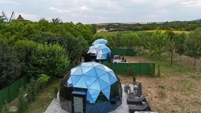 an aerial view of a domed house with a garden at Glass Domes - by The Wind Mills Hydropark in Gorna Malina