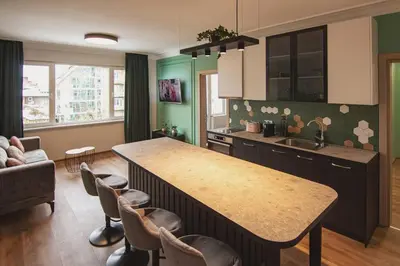 a kitchen with a island in the middle of a room at Jungle apartment in the center in Sofia