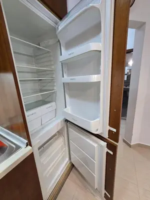 an empty refrigerator with its door open in a kitchen at Апартамент В204 Belvedere Holiday Club in Bansko