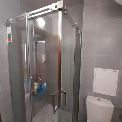 a shower stall in a bathroom with a toilet at Апартамент В204 Belvedere Holiday Club in Bansko