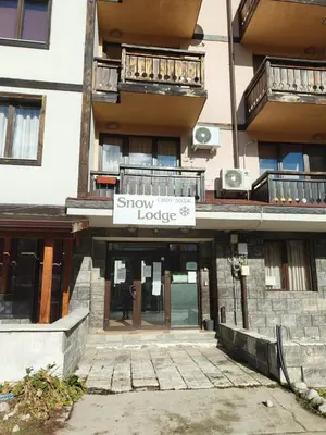 a building with a sign that says show me your lodge at Уютная квартира в комплексе Snow Lodge in Bansko