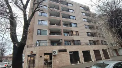 an apartment building on the corner of a street at Аpartment with Free Parking in Sofia