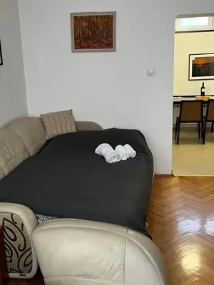 a bed in a room with two towels on it at Casa del Rey in Sofia