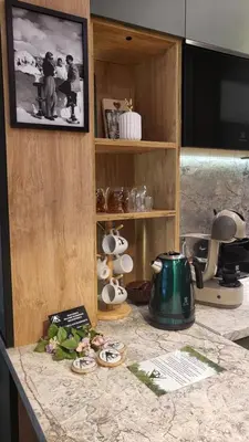 a kitchen counter with a tea kettle and a tv at Pinewood ANG premium luxurious apartment 15 in Borovets