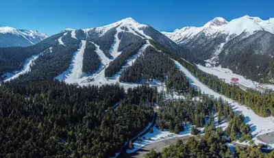 an aerial view of a snow covered mountain at IZ VIEW Apartment in Bansko
