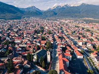 an aerial view of a city with mountains in the background at IZ VIEW Apartment in Bansko