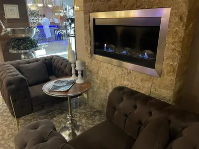 a living room with two couches and a fireplace at Мия 2 Deluxe Royal Spa in Velingrad