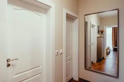 a room with a mirror and a hallway at Elegant Living Apartment 1 in Sofia