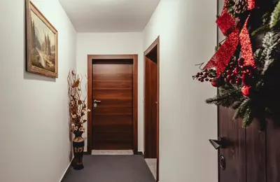 a hallway with a door and a christmas tree at Elegant Living Apartment 1 in Sofia