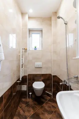 a bathroom with a toilet and a sink at Victor Hugo Studio in Sofia