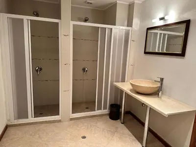 a bathroom with a sink and a walk in shower at St Ivan Rilski SPA Studio in Bansko