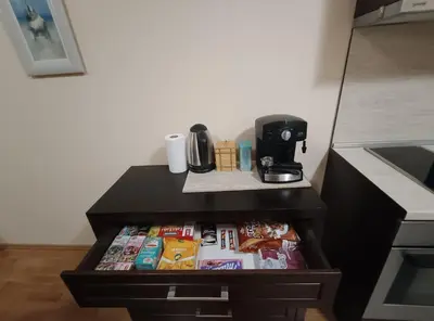 a black cabinet with food in it in a kitchen at Pravets spa resort apartments in Pravets