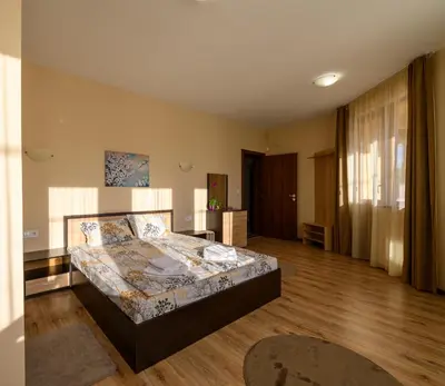 a bedroom with a bed in a room at Rila Hills in Samokov