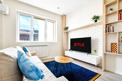 a living room with a couch and a tv at Skyline View - Very Central - Metro - Washer&Dryer in Sofia