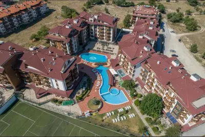 an aerial view of a large house with a swimming pool at Апартамент Belvedere G106 in Bansko