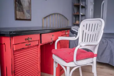 a red desk with two white chairs and a red seat at Top Center, 3BDR, Heart of the city, FREE Secured Parking in Sofia