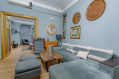 a living room with a couch and a table at Top Center, 3BDR, Heart of the city, FREE Secured Parking in Sofia