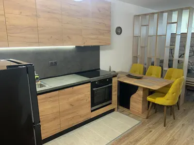 a kitchen with a table and a black refrigerator at SOFIA CENTRAL LUXURY apartment 