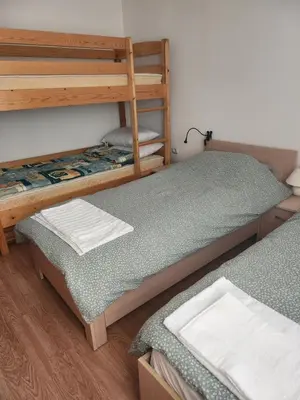a room with two bunk beds in a room at One bedroom Apartment in Bansko