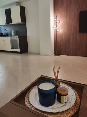 a plate with a cup of milk on a table at Modern 2BDRM in 5* Resort & pool in Sandanski