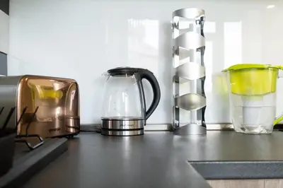 a group of appliances sitting on top of a counter at Orange friendly apartment near Vitosha blvd in Sofia