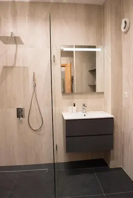 a bathroom with a sink and a shower at Top Center Designer Apartment in Sofia