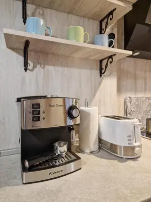 a kitchen counter with a toaster and a toaster at 8BD Retreat in Bansko Comfort & Mountain Charm by Flat Mаnager in Bansko