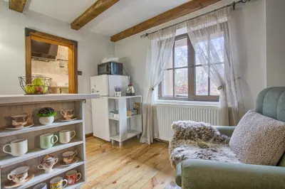 a living room with a couch and a window at 8BD Retreat in Bansko Comfort & Mountain Charm by Flat Mаnager in Bansko