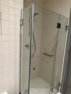 a shower with a glass door in a bathroom at Lodge Euphoria Studio in Borovets