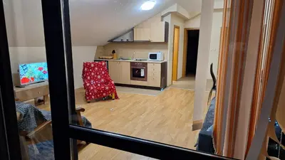 a view of a kitchen with a chair in a room at Aspen Suites A403 - Sky & Stars Dreamers in Razlog