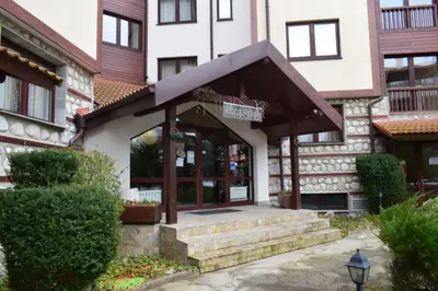 a building with an awning in front of it at Супер луксозен апартамент в Winslow in Bansko