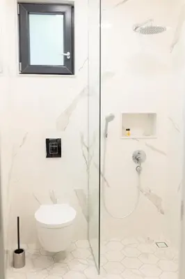 a bathroom with a shower and a toilet at Luxury rooms 12-1 in Plovdiv