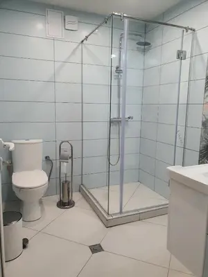 a bathroom with a shower and a toilet at Relax Srednogorska Panorama in Smolsko
