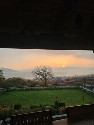 a view of a green field with the sunset at Relax Srednogorska Panorama in Smolsko
